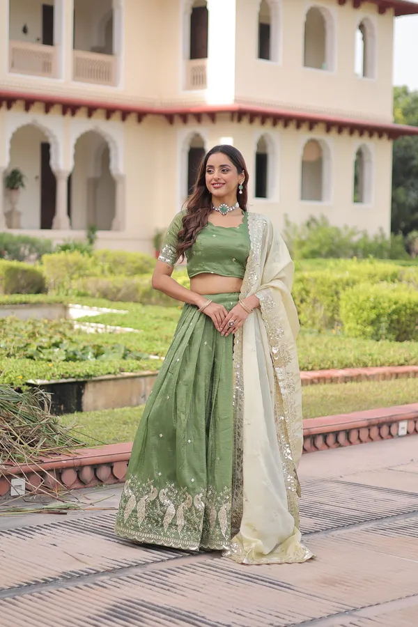 Elegant_Gold_Crush_Lehenga_adorned_with_sequins_and_zari_embroidered_work,_paired_with_an_unstitched_blouse_�_a_perfect_blend_of_shimmer_and_traditional_charm_for_festive_occasions._?