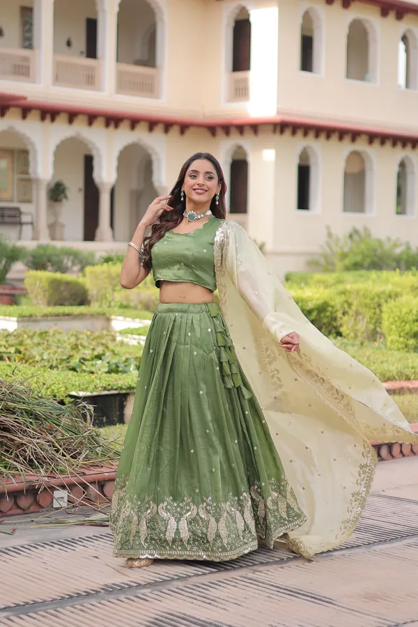 Elegant_Gold_Crush_Lehenga_adorned_with_sequins_and_zari_embroidered_work,_paired_with_an_unstitched_blouse_�_a_perfect_blend_of_shimmer_and_traditional_charm_for_festive_occasions._?
