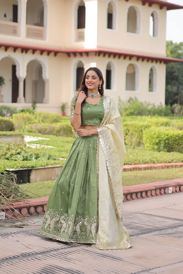 Elegant_Gold_Crush_Lehenga_adorned_with_sequins_and_zari_embroidered_work,_paired_with_an_unstitched_blouse_�_a_perfect_blend_of_shimmer_and_traditional_charm_for_festive_occasions._?