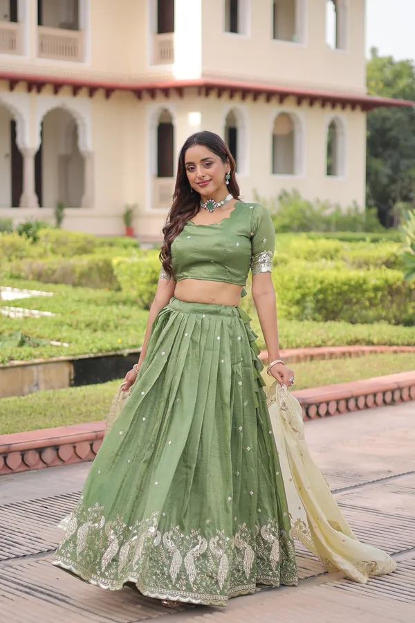 Elegant_Gold_Crush_Lehenga_adorned_with_sequins_and_zari_embroidered_work,_paired_with_an_unstitched_blouse_�_a_perfect_blend_of_shimmer_and_traditional_charm_for_festive_occasions._?