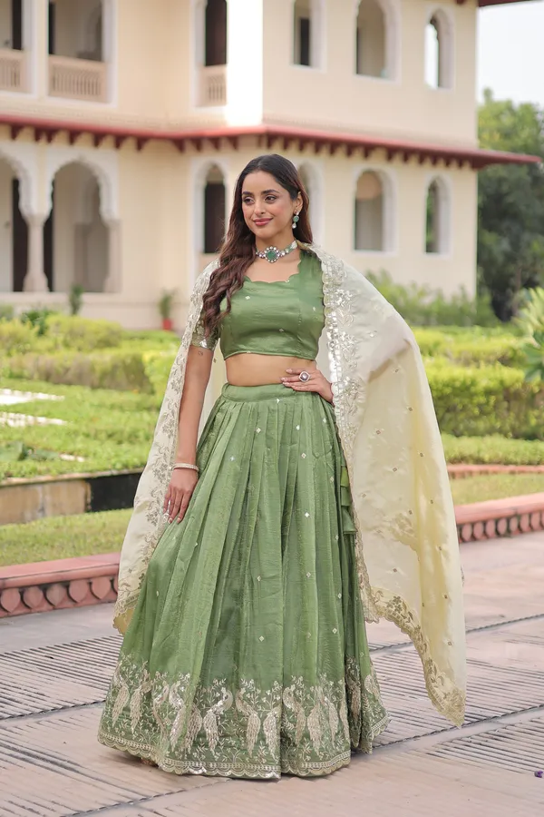 Elegant_Gold_Crush_Lehenga_adorned_with_sequins_and_zari_embroidered_work,_paired_with_an_unstitched_blouse_�_a_perfect_blend_of_shimmer_and_traditional_charm_for_festive_occasions._?