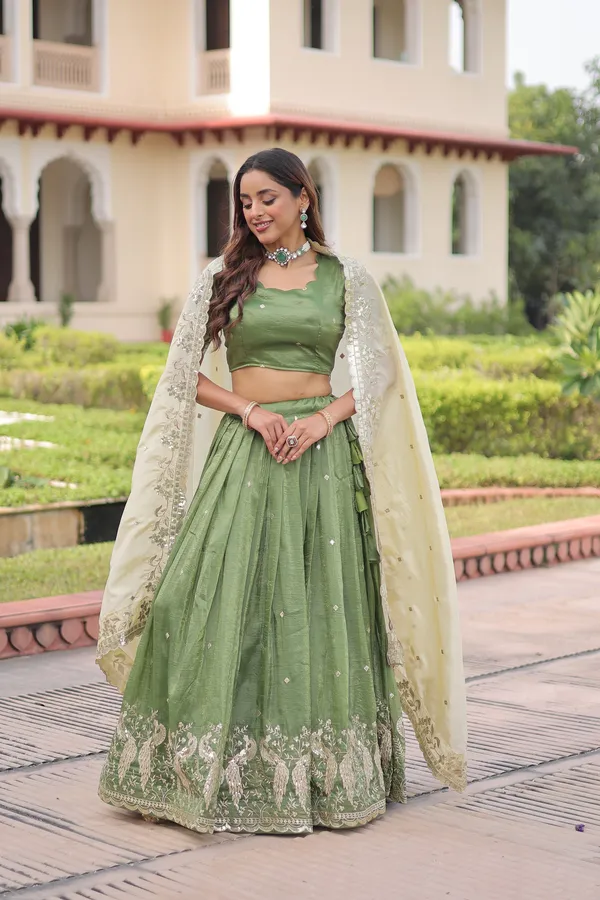 Elegant_Gold_Crush_Lehenga_adorned_with_sequins_and_zari_embroidered_work,_paired_with_an_unstitched_blouse_�_a_perfect_blend_of_shimmer_and_traditional_charm_for_festive_occasions._?