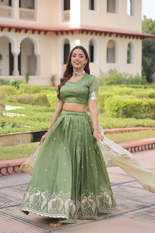 Elegant_Gold_Crush_Lehenga_adorned_with_sequins_and_zari_embroidered_work,_paired_with_an_unstitched_blouse_�_a_perfect_blend_of_shimmer_and_traditional_charm_for_festive_occasions._?