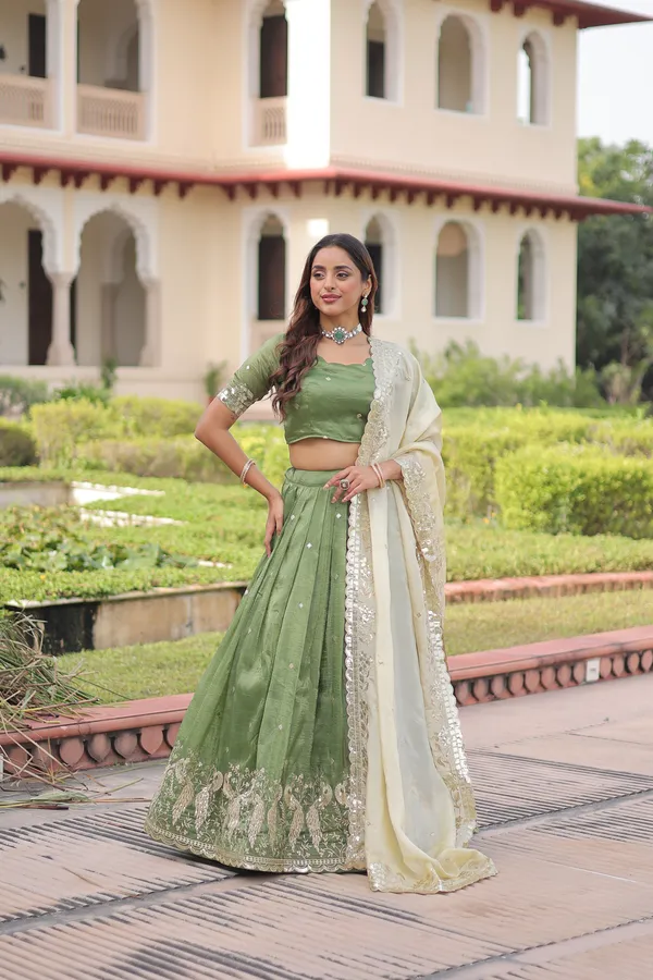 Elegant_Gold_Crush_Lehenga_adorned_with_sequins_and_zari_embroidered_work,_paired_with_an_unstitched_blouse_�_a_perfect_blend_of_shimmer_and_traditional_charm_for_festive_occasions._?