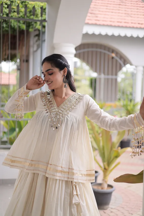 Elegant_Kora_Cotton_Lehenga_designed_with_beautiful_Zari_Patta_and_Gota_Patti_lace_work,_giving_a_rich_traditional_look._Paired_with_a_stitched_blouse_�_perfect_for_festive_and_Navratri_wear._?