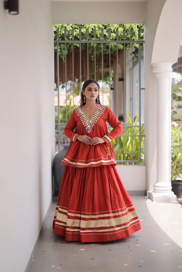 Elegant_Kora_Cotton_Lehenga_designed_with_beautiful_Zari_Patta_and_Gota_Patti_lace_work,_giving_a_rich_traditional_look._Paired_with_a_stitched_blouse_�_perfect_for_festive_and_Navratri_wear._?