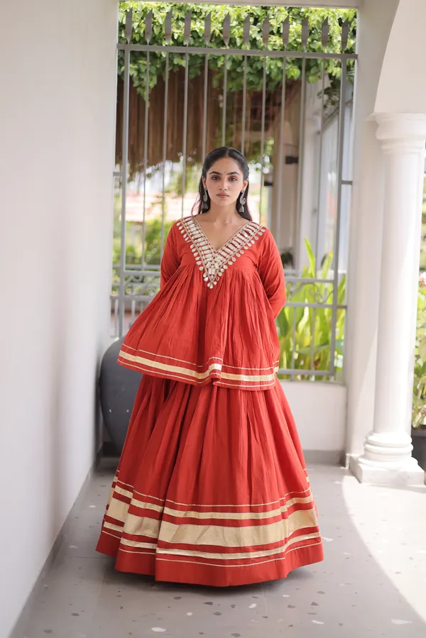 Elegant_Kora_Cotton_Lehenga_designed_with_beautiful_Zari_Patta_and_Gota_Patti_lace_work,_giving_a_rich_traditional_look._Paired_with_a_stitched_blouse_�_perfect_for_festive_and_Navratri_wear._?
