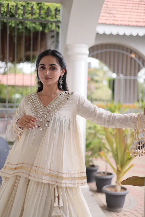 Elegant_Kora_Cotton_Lehenga_designed_with_beautiful_Zari_Patta_and_Gota_Patti_lace_work,_giving_a_rich_traditional_look._Paired_with_a_stitched_blouse_�_perfect_for_festive_and_Navratri_wear._?