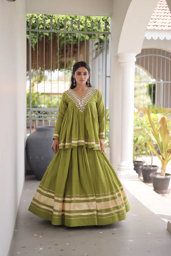 Elegant_Kora_Cotton_Lehenga_designed_with_beautiful_Zari_Patta_and_Gota_Patti_lace_work,_giving_a_rich_traditional_look._Paired_with_a_stitched_blouse_�_perfect_for_festive_and_Navratri_wear._?