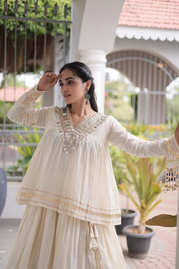 Elegant_Kora_Cotton_Lehenga_designed_with_beautiful_Zari_Patta_and_Gota_Patti_lace_work,_giving_a_rich_traditional_look._Paired_with_a_stitched_blouse_�_perfect_for_festive_and_Navratri_wear._?