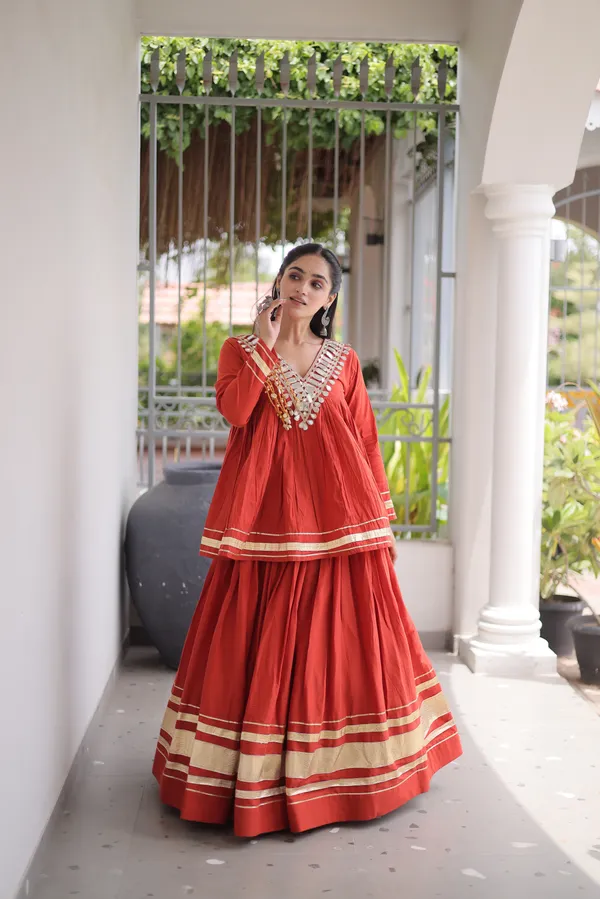 Elegant_Kora_Cotton_Lehenga_designed_with_beautiful_Zari_Patta_and_Gota_Patti_lace_work,_giving_a_rich_traditional_look._Paired_with_a_stitched_blouse_�_perfect_for_festive_and_Navratri_wear._?