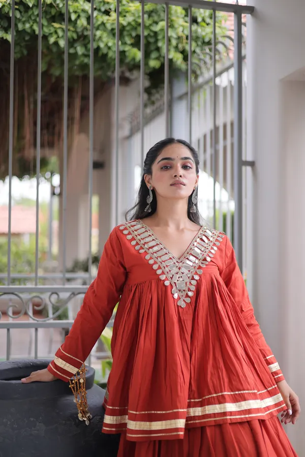 Elegant_Kora_Cotton_Lehenga_designed_with_beautiful_Zari_Patta_and_Gota_Patti_lace_work,_giving_a_rich_traditional_look._Paired_with_a_stitched_blouse_�_perfect_for_festive_and_Navratri_wear._?