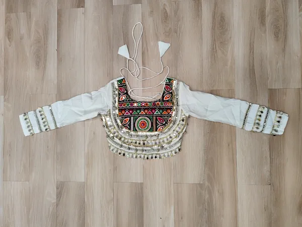 Celebrate_true_Navratri_vibes_with_this_traditional_&_spiritual_outfit_that_beautifully_blends_festive_fun_with_cultural_charm._Choose_from_vibrant_colors_in_this_Lehenga_with_Top,_perfect_for_dancing,_devotion,_and_the_joy_of_togetherness._Comes_with_fully_stitched_lehenga_&_blouse_for_a_ready-to-wear_festive_look._???