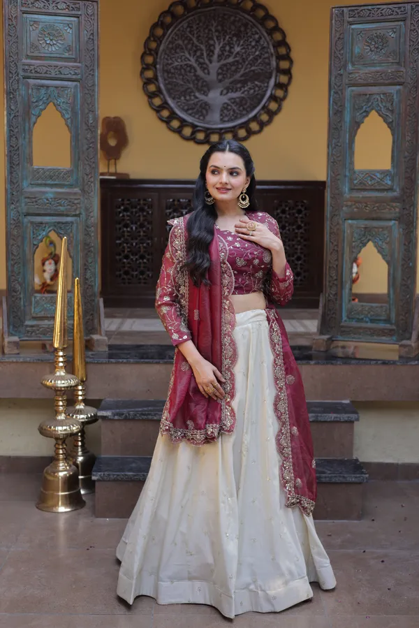 beautifully_designed_with_zari_&_sequins_embroidered_work,_giving_a_rich_and_elegant_look._Perfect_for_festive_&_party_wear._Comes_with_an_unstitched_blouse_for_a_customized_fit.