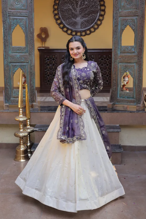 beautifully_designed_with_zari_&_sequins_embroidered_work,_giving_a_rich_and_elegant_look._Perfect_for_festive_&_party_wear._Comes_with_an_unstitched_blouse_for_a_customized_fit.