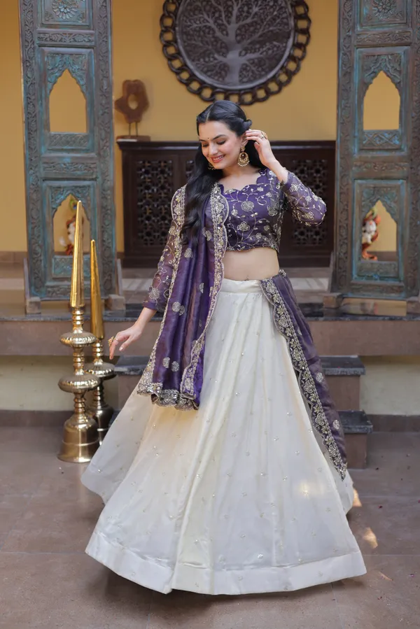 beautifully_designed_with_zari_&_sequins_embroidered_work,_giving_a_rich_and_elegant_look._Perfect_for_festive_&_party_wear._Comes_with_an_unstitched_blouse_for_a_customized_fit.