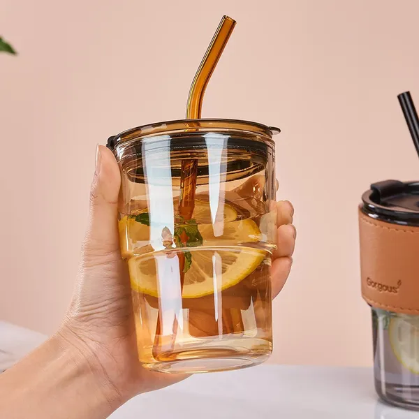 Glass_Reusable_Sipper_Bottle_with_Leather_Sleeve_Glass_Coffee_Mug_with_Silicone_Straw_and_Leakproof_Lid_Pack_of_1_Tumbler_for_Coffee,_Tea,_Milk_Beverages_435ml_(Golden)