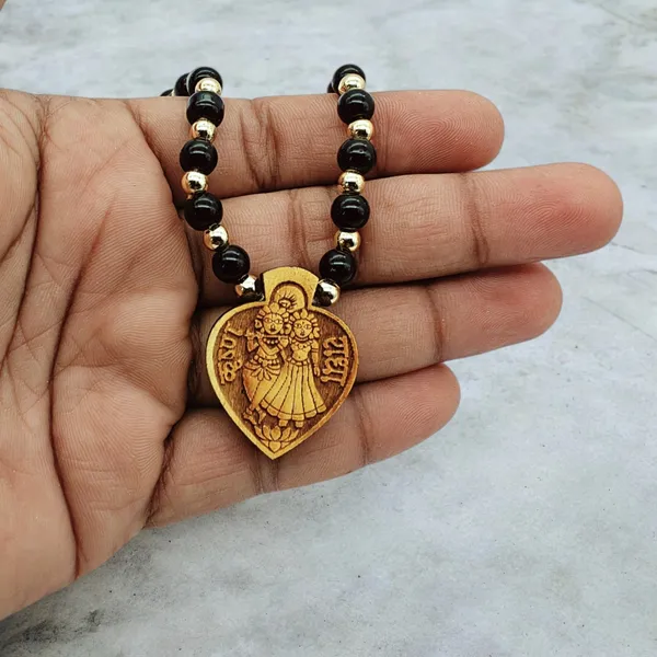 Wooden_Carving_Radha_Krishna_pendant_with_Black_crystal_chain_(H.HRT.Bcry)