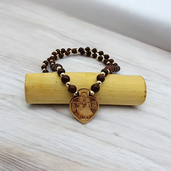 Wooden_Carving_Radha_Krishna_pendant_with_Lal_Chandan_chain_(RK.HRT.Lal.Chn)
