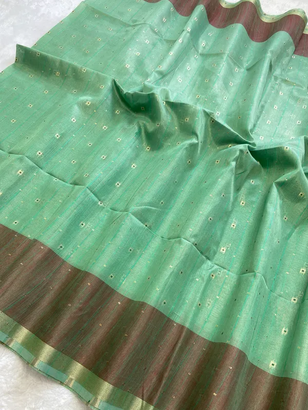 Sarika_Rama_Green_–_Diwali_Special_|_Soft_Tissue_Linen_Silk_Saree_with_Weaving,_Border_&_Rich_Pallu,_Sequence_&_Running_Blouse_with_Tassels
