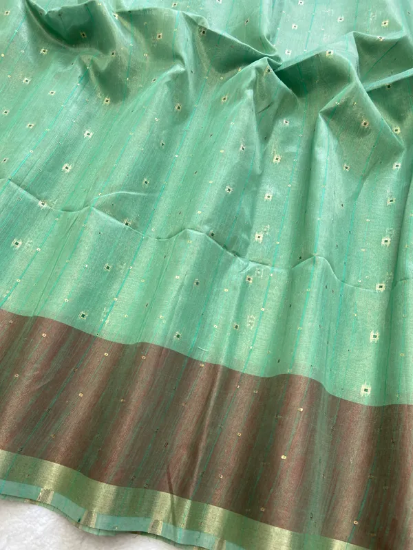 Sarika_Rama_Green_–_Diwali_Special_|_Soft_Tissue_Linen_Silk_Saree_with_Weaving,_Border_&_Rich_Pallu,_Sequence_&_Running_Blouse_with_Tassels