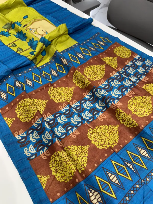 Cow_Blue_–_Cow_Motif_Navratri_Special_|_Soft_Desi_Tussar_Silk_Saree_with_Digital_Print,_Border_&_Contrast_Print_Blouse_with_Tassels