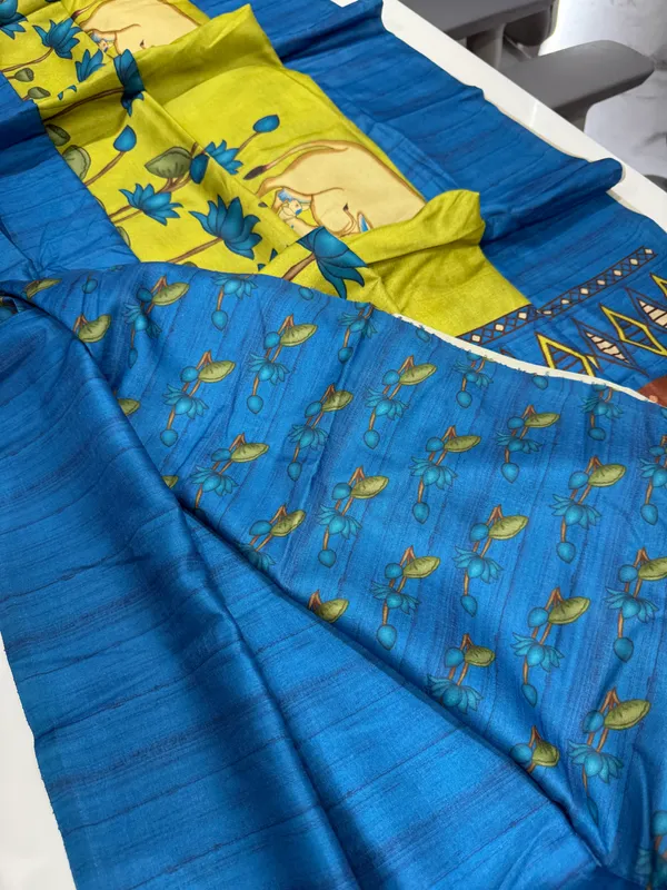 Cow_Blue_–_Cow_Motif_Navratri_Special_|_Soft_Desi_Tussar_Silk_Saree_with_Digital_Print,_Border_&_Contrast_Print_Blouse_with_Tassels