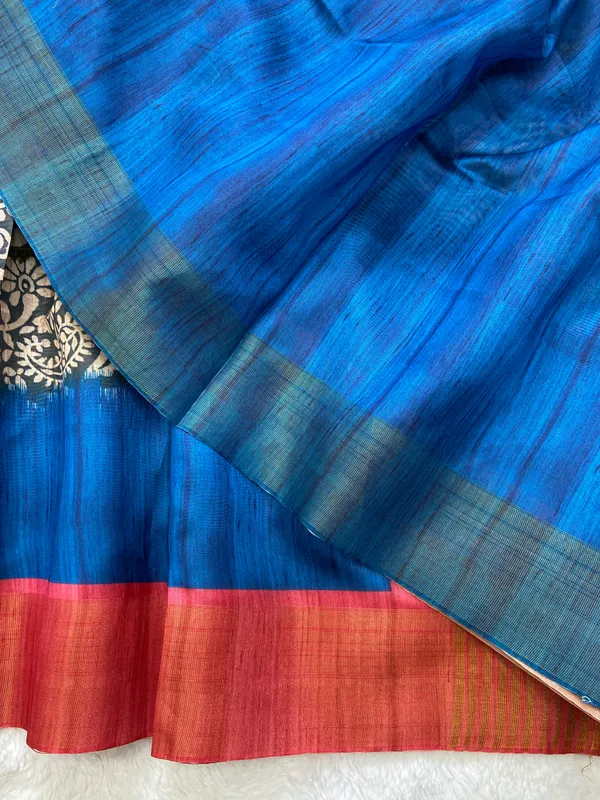 Mirza_Red_&_Blue_–_Diwali_Special_|_Soft_Tussar_Silk_Saree_with_Print,_Border_&_Contrast_Print_Blouse_with_Tassels