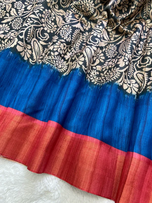 Mirza_Red_&_Blue_–_Diwali_Special_|_Soft_Tussar_Silk_Saree_with_Print,_Border_&_Contrast_Print_Blouse_with_Tassels