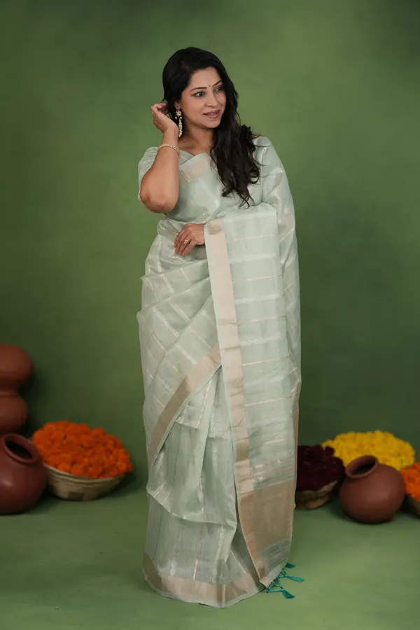 Soft_Linen_Cotton_Silk_sarees_with_Beautiful_Weaving__Zari_Butti_Design_With_Attractive_Border_&_Rich_Pallu__And_Running__Plain_Blouse_With_Tassels