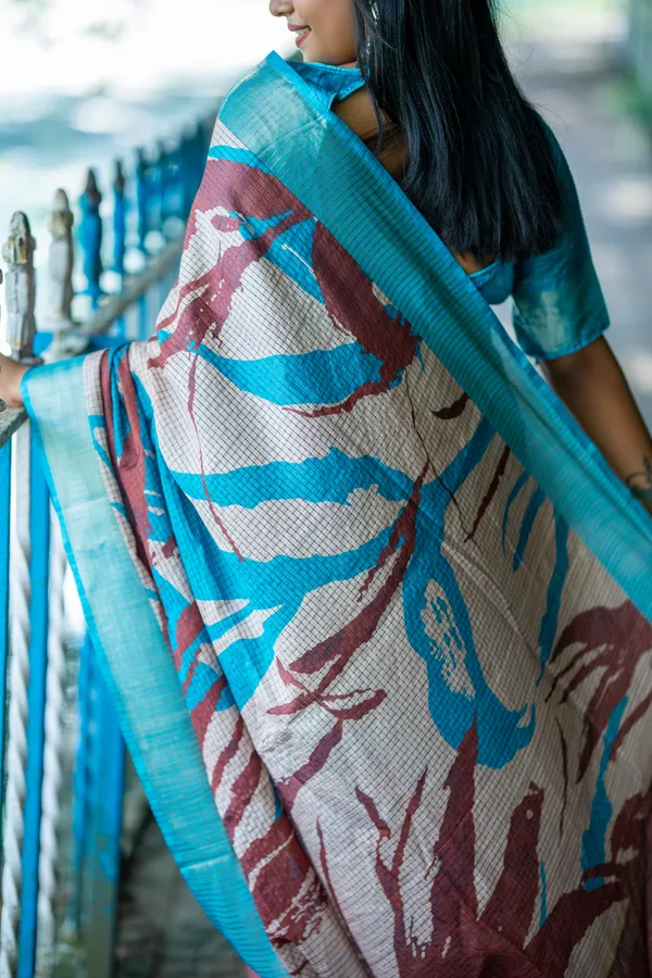 Aarathi_Coffee_Brown_&_Sky_Blue_–_Aarti_Glow_Diwali_Special_|_Soft_Tussar_Silk_Saree_with_Digital_Print,_Checks_Design_Saree_&_Digital_Print_Blouse