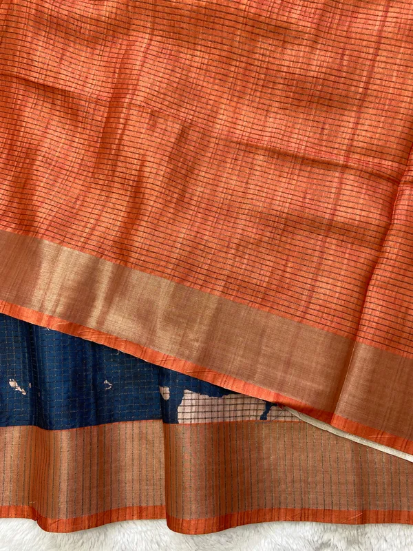 Aarathi_Blue_&_Orange_–_Aarti_Glow_Diwali_Special_|_Soft_Tussar_Silk_Saree_with_Digital_Print,_Checks_Design_Saree_&_Digital_Print_Blouse_with_Tassels