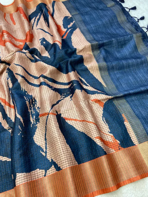 Aarathi_Blue_&_Orange_–_Aarti_Glow_Diwali_Special_|_Soft_Tussar_Silk_Saree_with_Digital_Print,_Checks_Design_Saree_&_Digital_Print_Blouse_with_Tassels