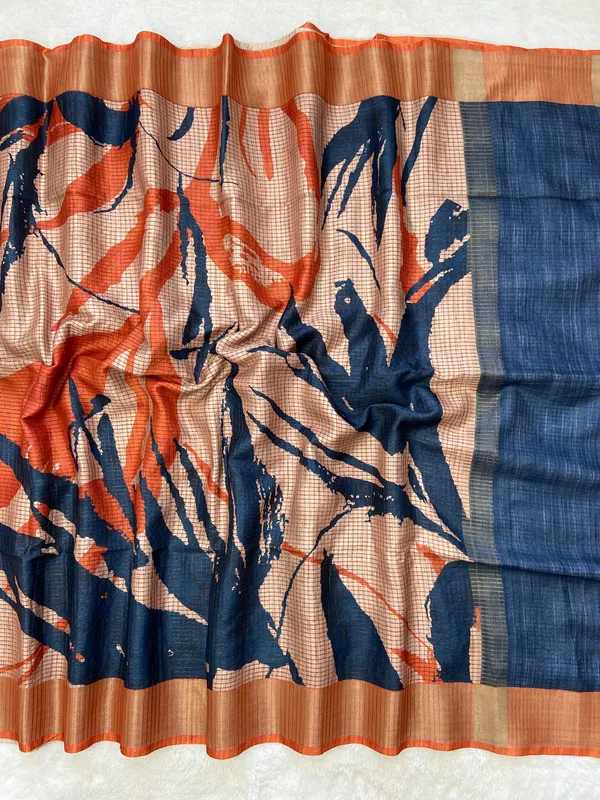 Aarathi_Blue_&_Orange_–_Aarti_Glow_Diwali_Special_|_Soft_Tussar_Silk_Saree_with_Digital_Print,_Checks_Design_Saree_&_Digital_Print_Blouse_with_Tassels