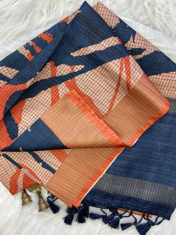 Aarathi_Blue_&_Orange_–_Aarti_Glow_Diwali_Special_|_Soft_Tussar_Silk_Saree_with_Digital_Print,_Checks_Design_Saree_&_Digital_Print_Blouse_with_Tassels
