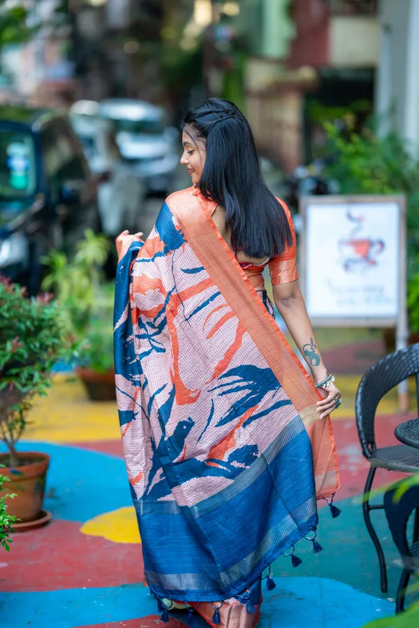 Aarathi_Blue_&_Orange_–_Aarti_Glow_Diwali_Special_|_Soft_Tussar_Silk_Saree_with_Digital_Print,_Checks_Design_Saree_&_Digital_Print_Blouse_with_Tassels