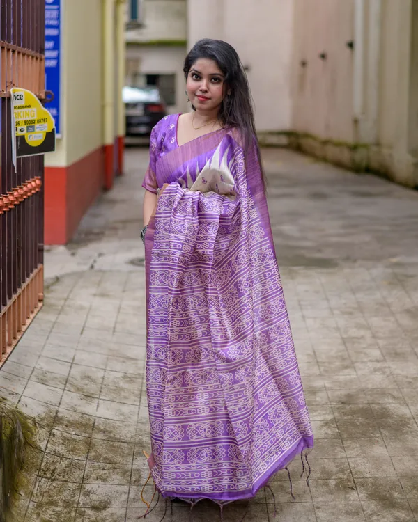 Manjusha_Purple_–_Treasured_Navratri_Special_|_Soft_Tussar_Silk_Saree_with_Print,_Border_&_Contrast_Print_Blouse_with_Tassels