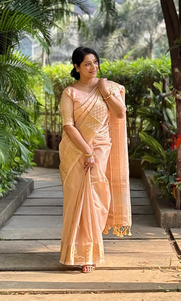 Jagvi_Peach_–_Diwali_Special_|_Soft_Tissue_Silk_Saree_with_Weaving,_Border_&_Rich_Pallu,_Sequence_&_Running_Blouse_with_Tassels