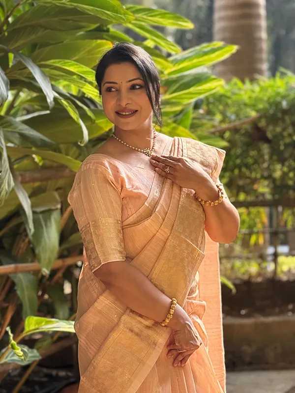 Jagvi_Peach_–_Diwali_Special_|_Soft_Tissue_Silk_Saree_with_Weaving,_Border_&_Rich_Pallu,_Sequence_&_Running_Blouse_with_Tassels