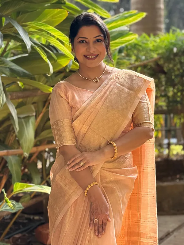 Jagvi_Peach_–_Diwali_Special_|_Soft_Tissue_Silk_Saree_with_Weaving,_Border_&_Rich_Pallu,_Sequence_&_Running_Blouse_with_Tassels