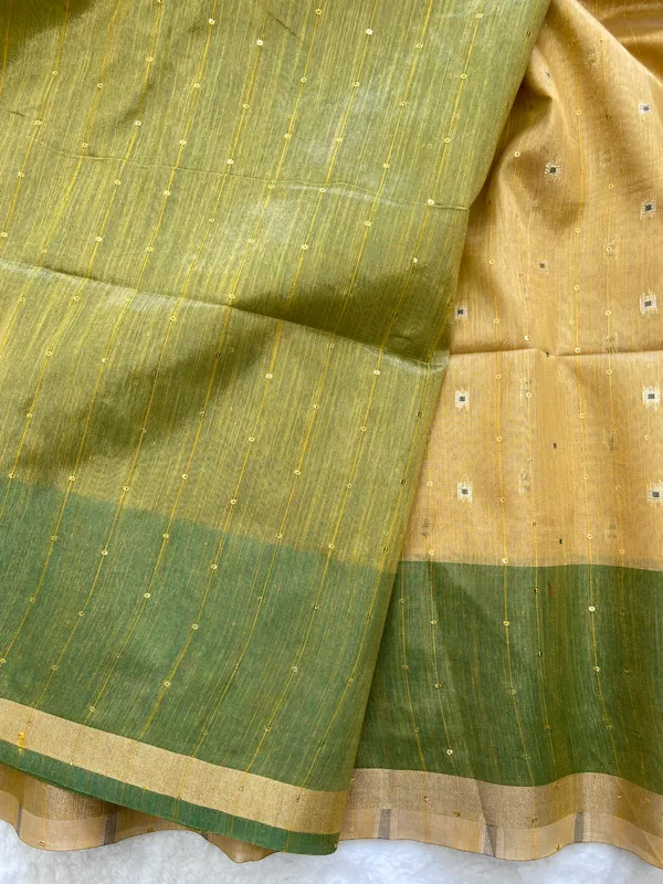 Soft_Tissue_Linen_Silk_sarees_with_Beautiful_Weaving_With_Attractive_Border_&_Rich_Pallu_With_Sequence_And_Running_Blouse_With_Tassels