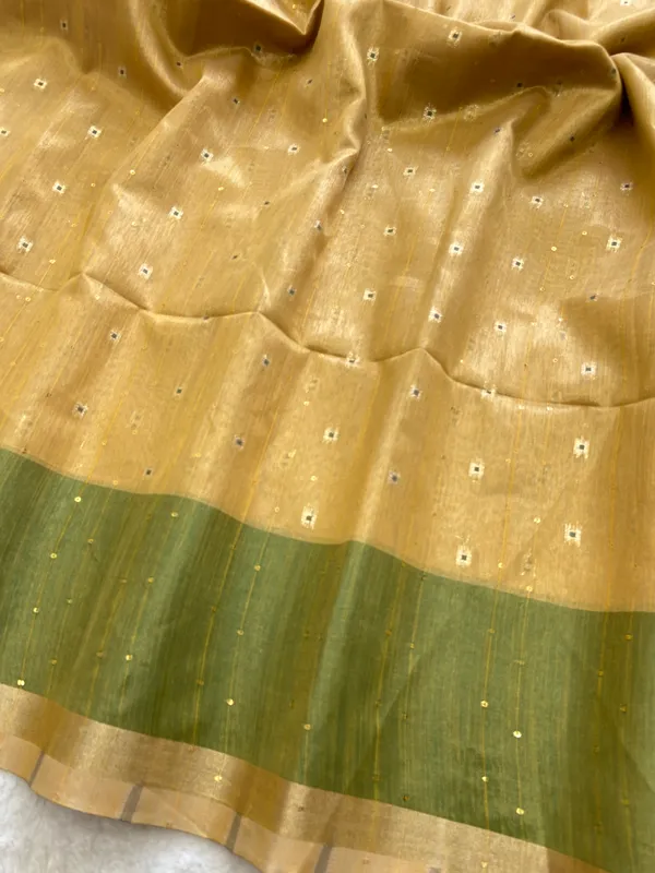 Soft_Tissue_Linen_Silk_sarees_with_Beautiful_Weaving_With_Attractive_Border_&_Rich_Pallu_With_Sequence_And_Running_Blouse_With_Tassels