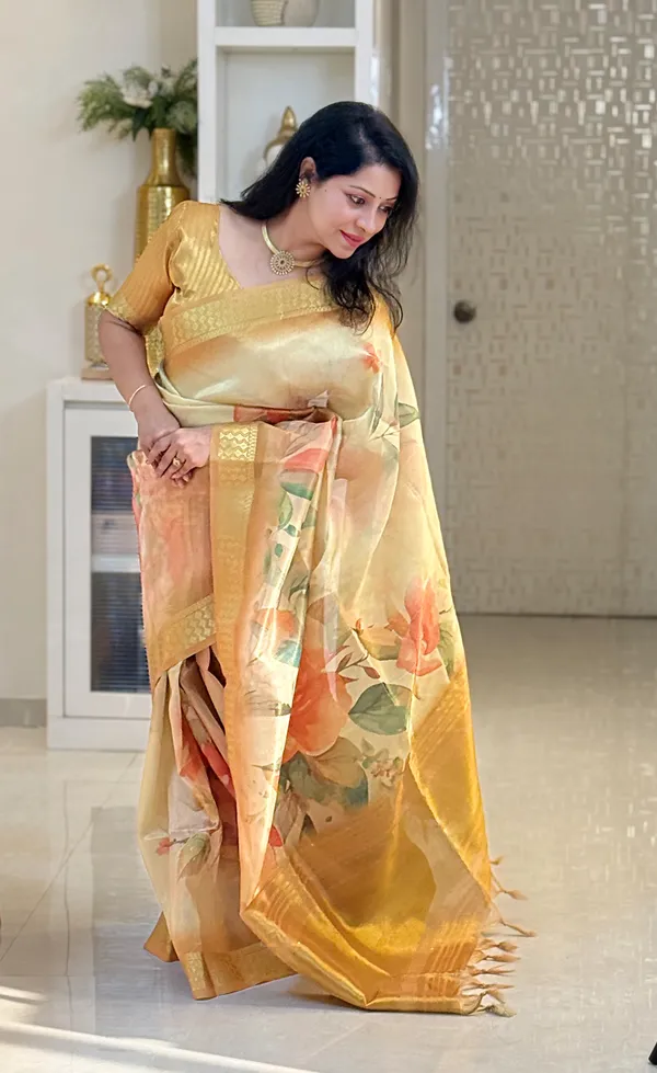 Dhriti_Yellow_–_Diwali_Special_|_Soft_Tissue_Silk_Saree_with_Digital_Print,_Border_&_Rich_Pallu,_Sequence_&_Contrast_Print_Blouse_with_Tassels