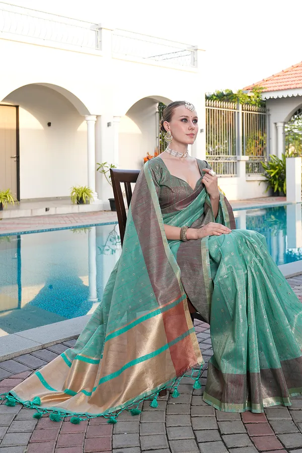 Sarika_Rama_Green_–_Diwali_Special_|_Soft_Tissue_Linen_Silk_Saree_with_Weaving,_Border_&_Rich_Pallu,_Sequence_&_Running_Blouse_with_Tassels