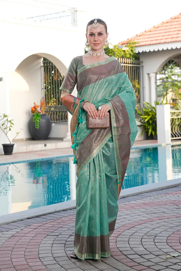 Sarika_Rama_Green_–_Diwali_Special_|_Soft_Tissue_Linen_Silk_Saree_with_Weaving,_Border_&_Rich_Pallu,_Sequence_&_Running_Blouse_with_Tassels