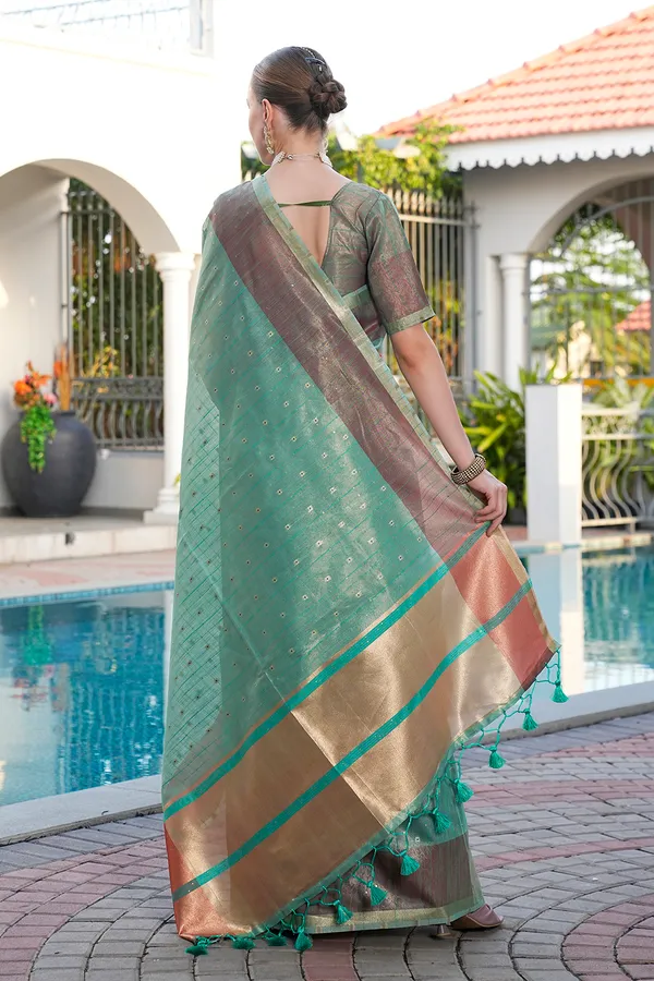 Sarika_Rama_Green_–_Diwali_Special_|_Soft_Tissue_Linen_Silk_Saree_with_Weaving,_Border_&_Rich_Pallu,_Sequence_&_Running_Blouse_with_Tassels