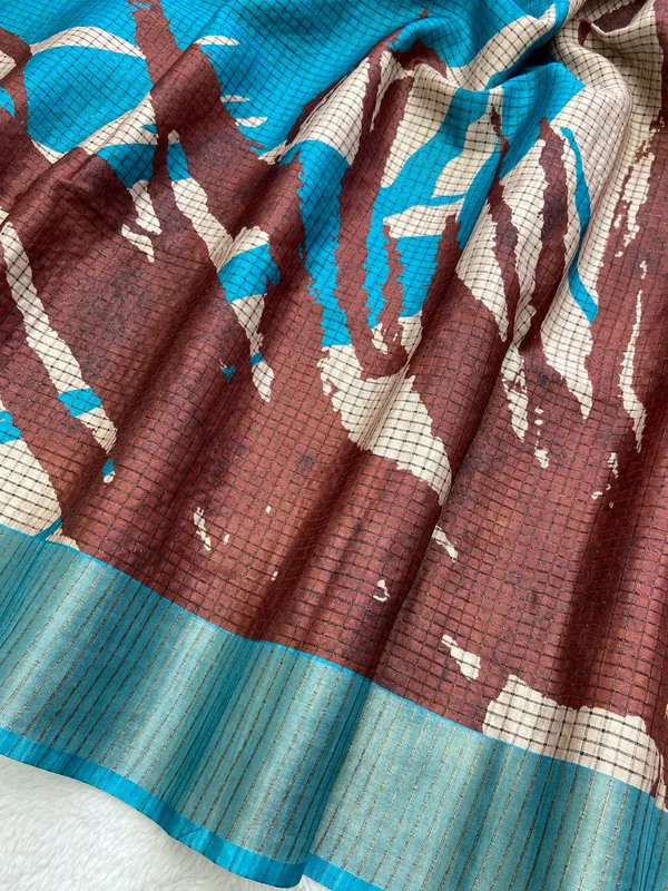 Aarathi_Coffee_Brown_&_Sky_Blue_–_Aarti_Glow_Diwali_Special_|_Soft_Tussar_Silk_Saree_with_Digital_Print,_Checks_Design_Saree_&_Digital_Print_Blouse