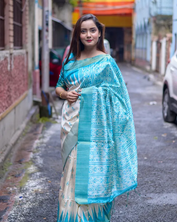Soft_Tussar_Silk_sarees_with_Beautiful_Print_With_Attractive_Border_And_Contrast_Print_Blouse_With_Tassels