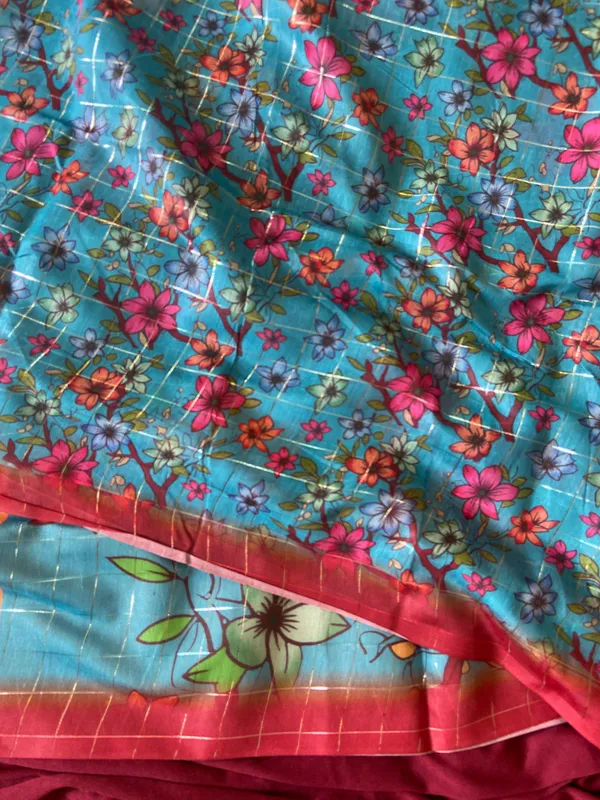 Baani_Orange_–_Diwali_Special_|_Soft_Semi_Tussar_Silk_Saree_with_Digital_Print,_Border_&_Contrast_Print_Blouse_with_Tassels