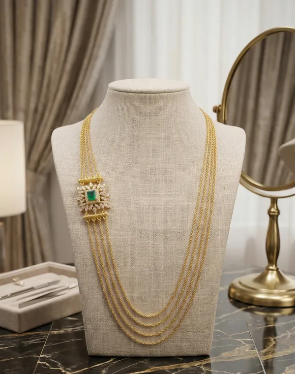 Luxury_Multi-Strand_Gold_Chain_Necklace_with_Royal_Green_Emerald_Side_Pendant